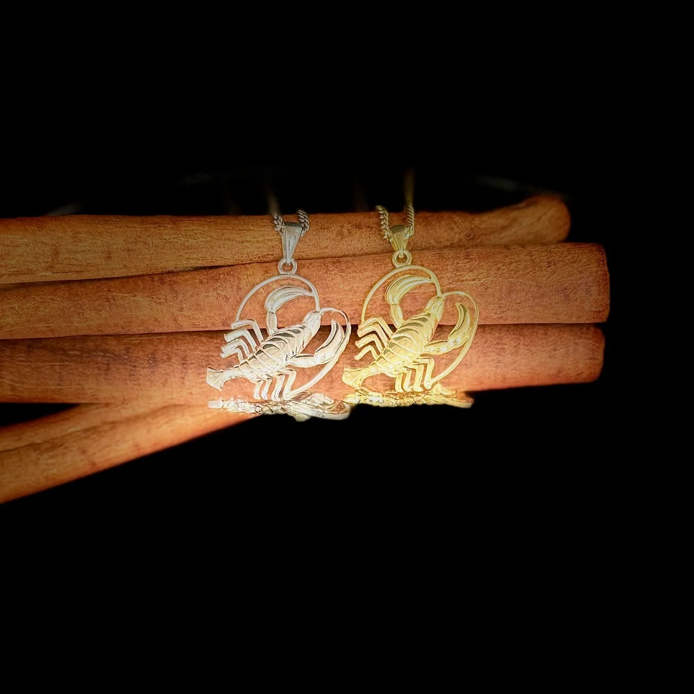 Dazzling gold and silver scorpion pendants, perfect for zodiac lovers seeking a unique style statement.