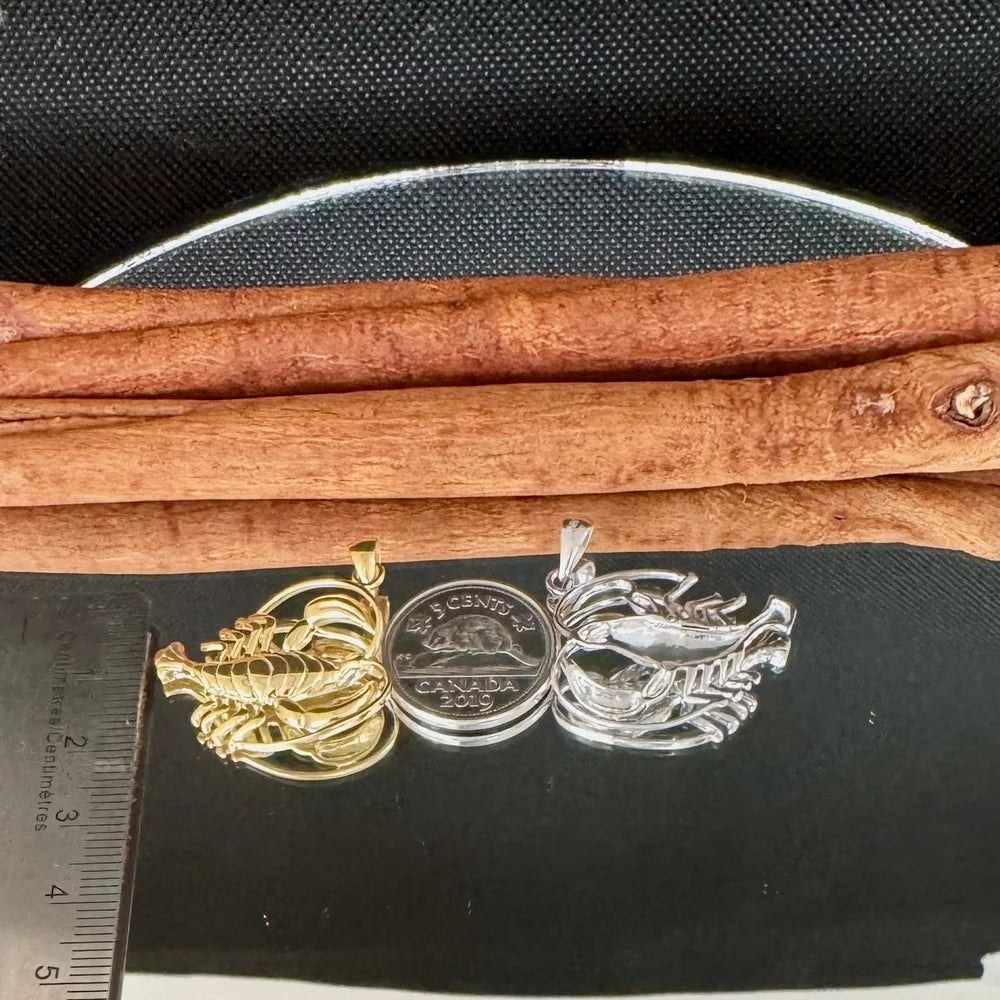 Gold and silver lobster pendants for women, featuring detailed craftsmanship, perfect for nautical-themed jewelry lovers.