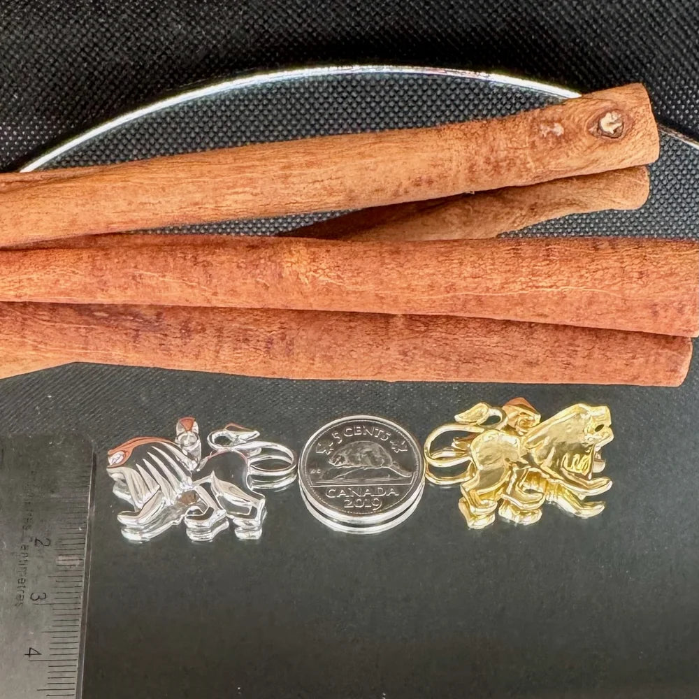 Silver and gold lion pendants, perfect for unisex styles, ideal for animal lovers and unique jewelry enthusiasts.