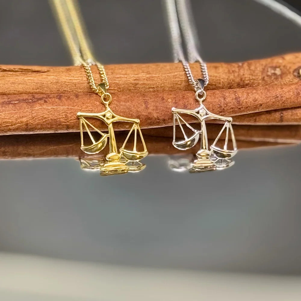 Gold and silver scales necklace, a stylish gift for women who appreciate minimalist legal-themed jewelry. Perfect for any occasion.