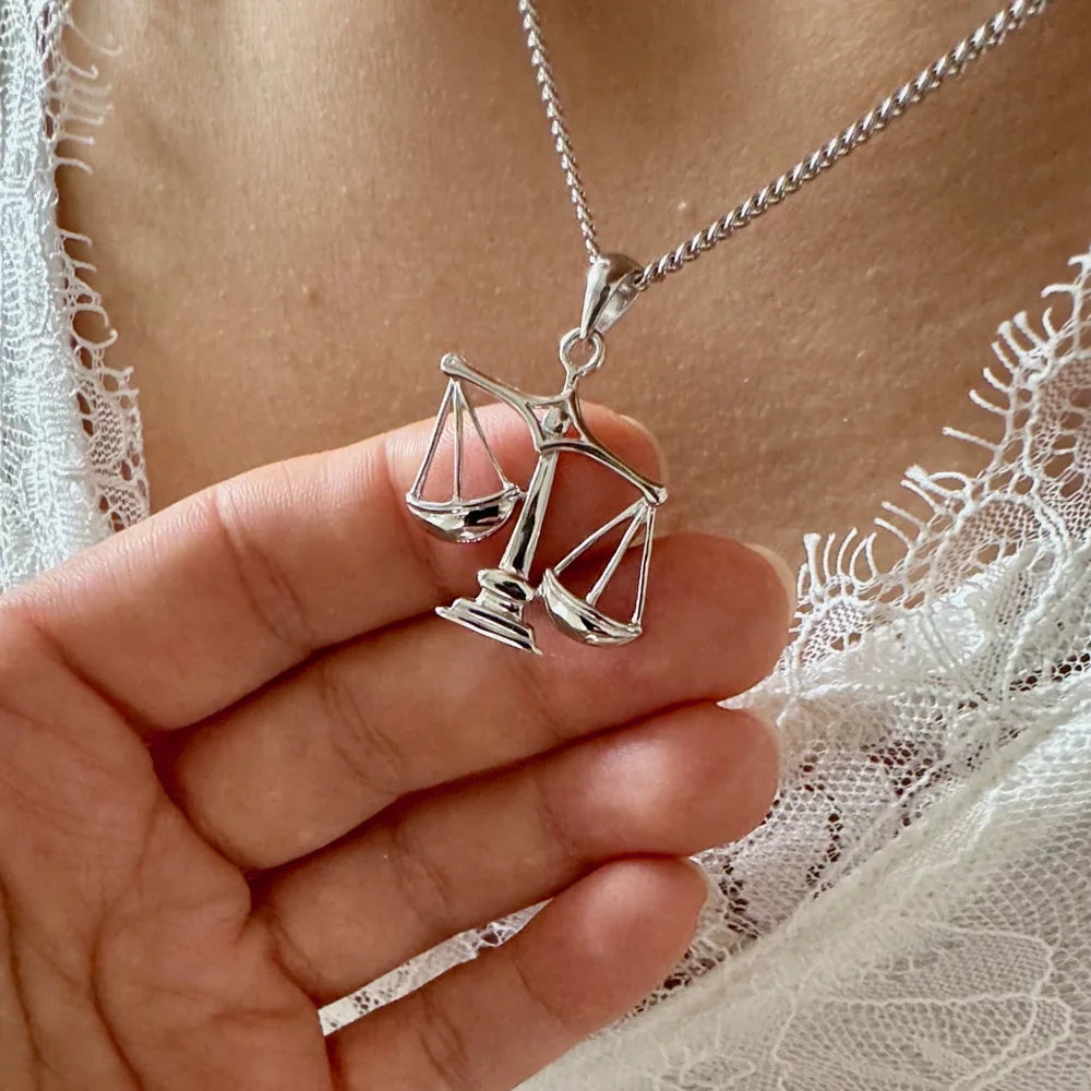 Silver scales pendant necklace, perfect for women seeking a minimalist, legal-inspired accessory for everyday wear.