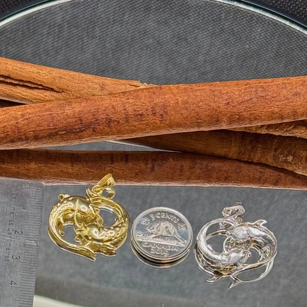 Gold and silver dolphin pendant necklaces, perfect for women who love unique vintage-style ocean-inspired jewelry.