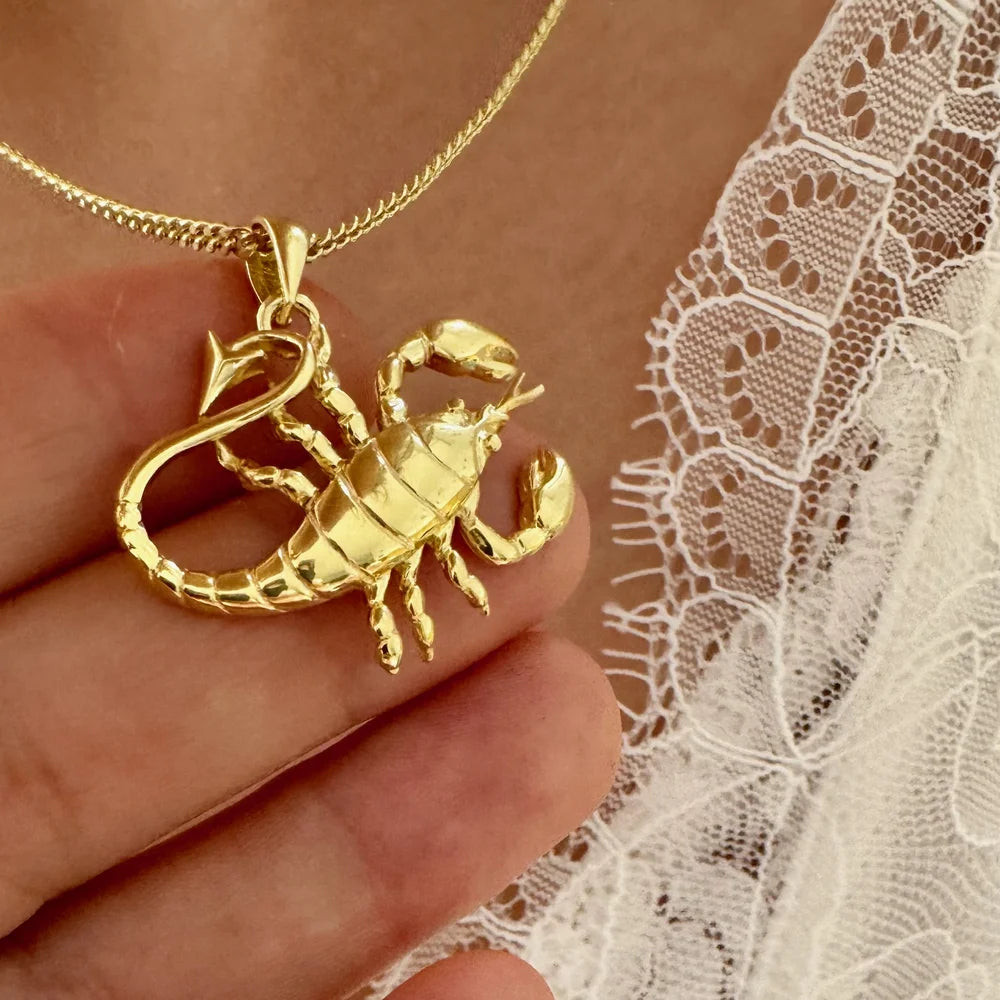 Gold scorpion pendant necklace, perfect for women who love unique statement jewelry, ideal for casual or bohemian styles.
