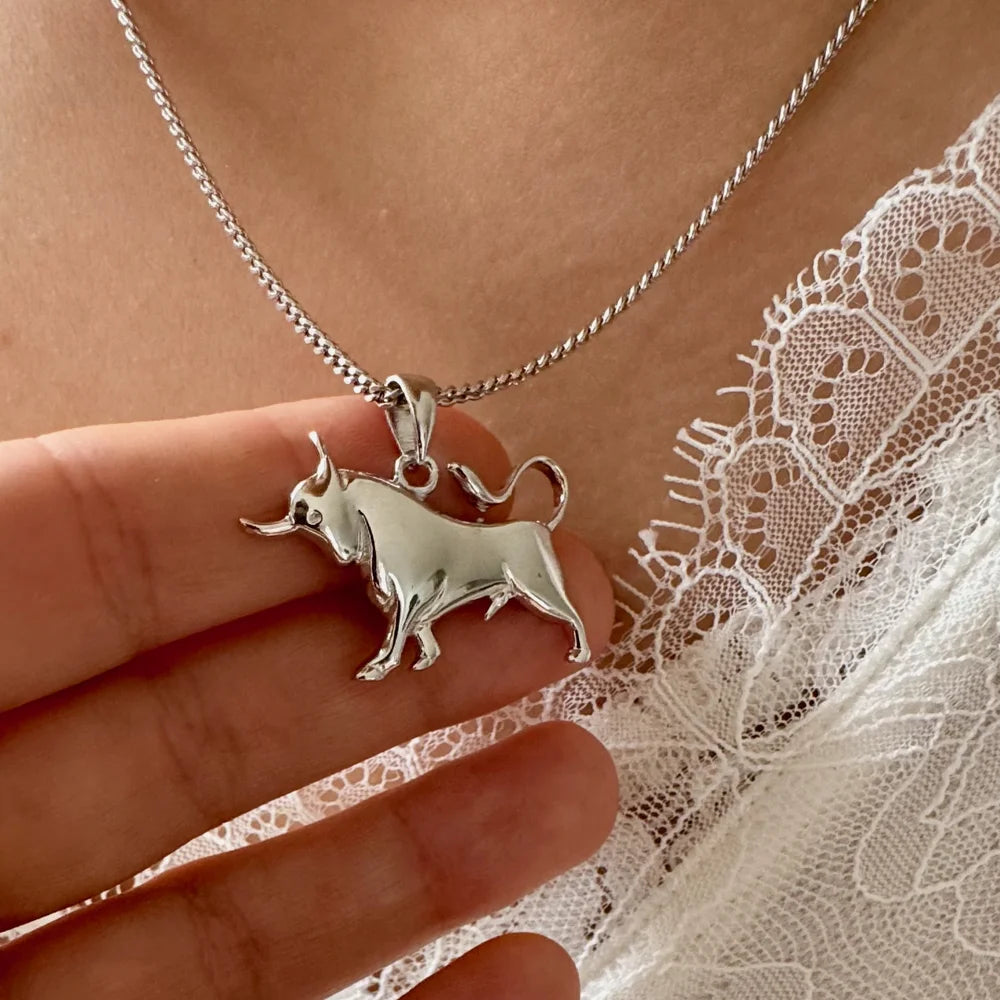 Sterling silver bull pendant necklace, perfect for animal lovers, adds a unique touch to women's casual or bohemian outfits.