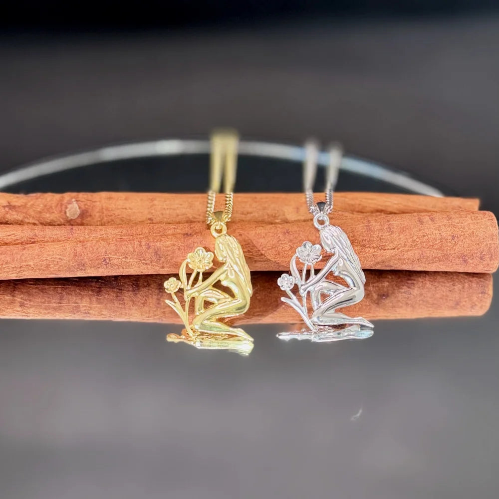 Delicate gold and silver flower girl pendants, perfect for women who love unique, nature-inspired jewelry.
