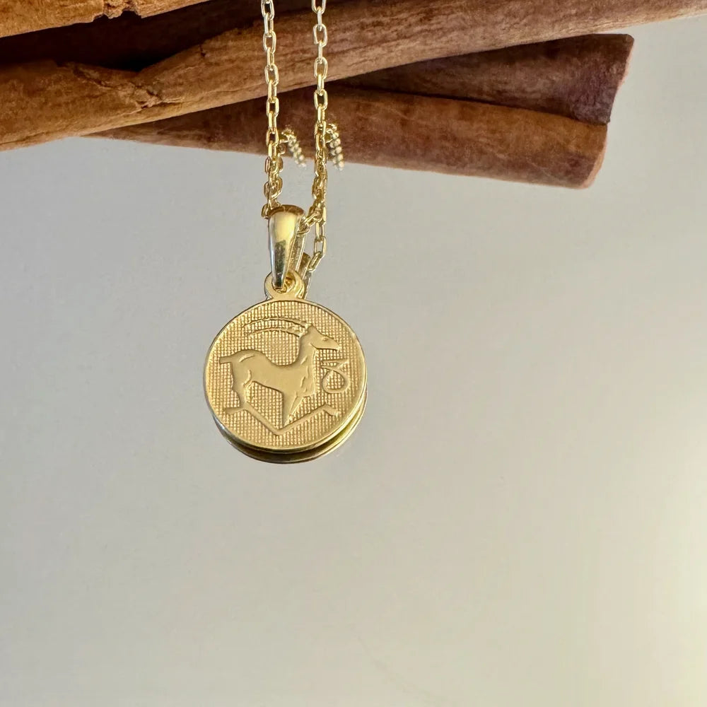 Gold pendant necklace featuring a detailed dog design, perfect for women who love vintage, unique jewelry.