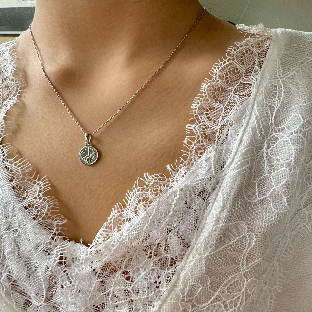 Sterling silver necklace with a celestial pendant, perfect for women seeking a minimalist bohemian look.