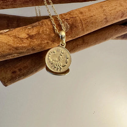Gold Scorpio zodiac pendant necklace, perfect for women who appreciate minimalist and personalized jewelry styles.