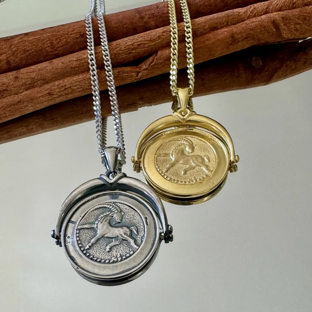 Silver and gold unicorn locket necklaces, perfect for women; a vintage-inspired accessory for special occasions.