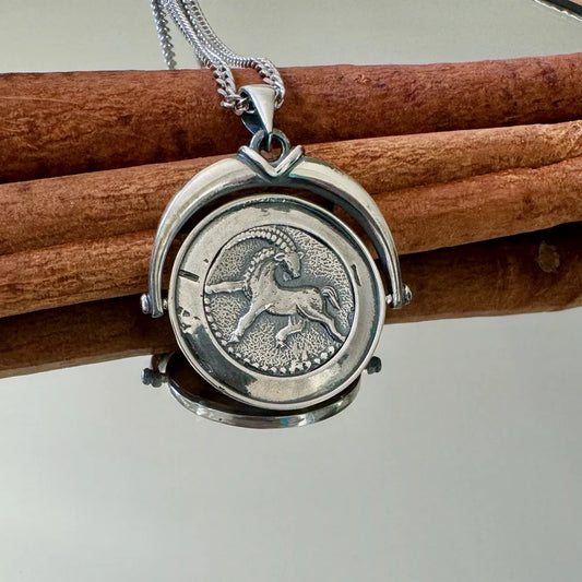 Sterling silver vintage Capricorn pendant necklace for women, showcasing intricate detailing, perfect for astrology lovers.