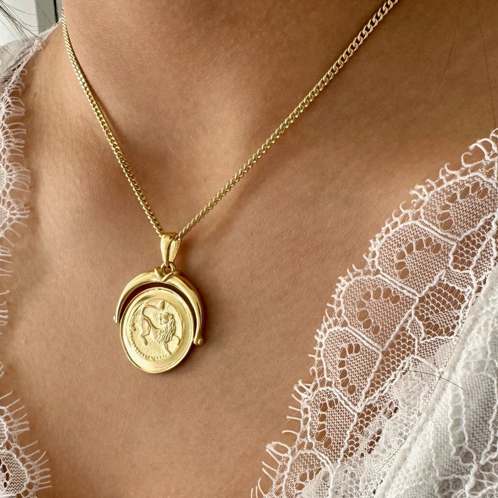 Gold vintage coin pendant necklace on a delicate chain, perfect for women seeking a unique, classic accessory.