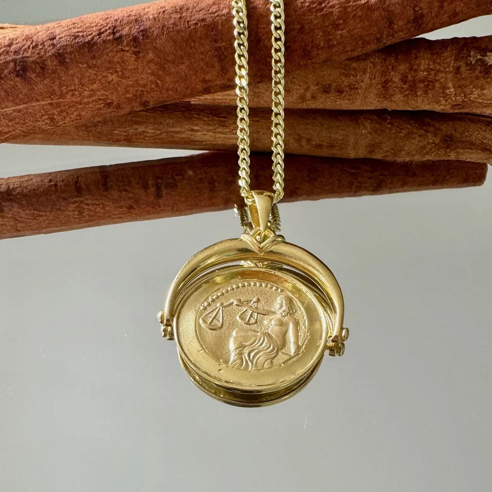 Gold zodiac pendant necklace featuring the Libra sign, perfect for women who love minimalist, celestial jewelry.