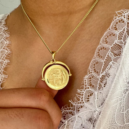 Gold vintage-style pendant necklace featuring a zodiac coin design, perfect for women who love classic jewelry.