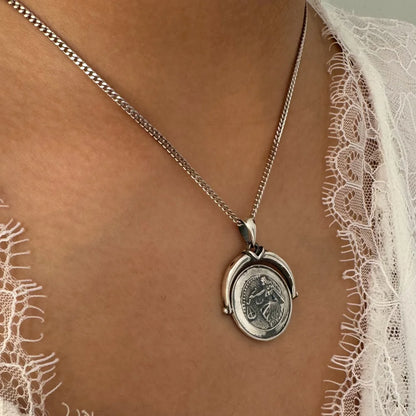 Silver pendant necklace featuring a vintage coin design, perfect for women seeking minimalist style for any occasion.