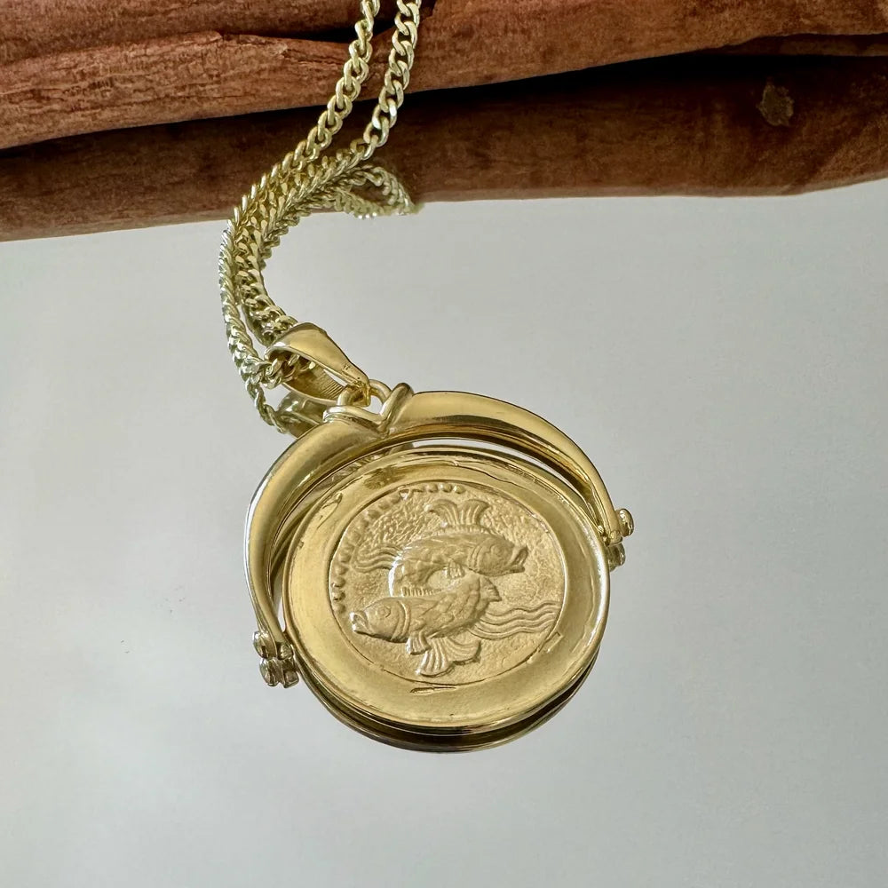 Gold vintage fish locket pendant necklace, perfect for women who appreciate classic jewelry styles. Ideal for any occasion.