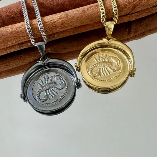 Gold and silver scorpion locket necklace, perfect for a unisex, vintage style. Ideal for daily wear or special occasions.