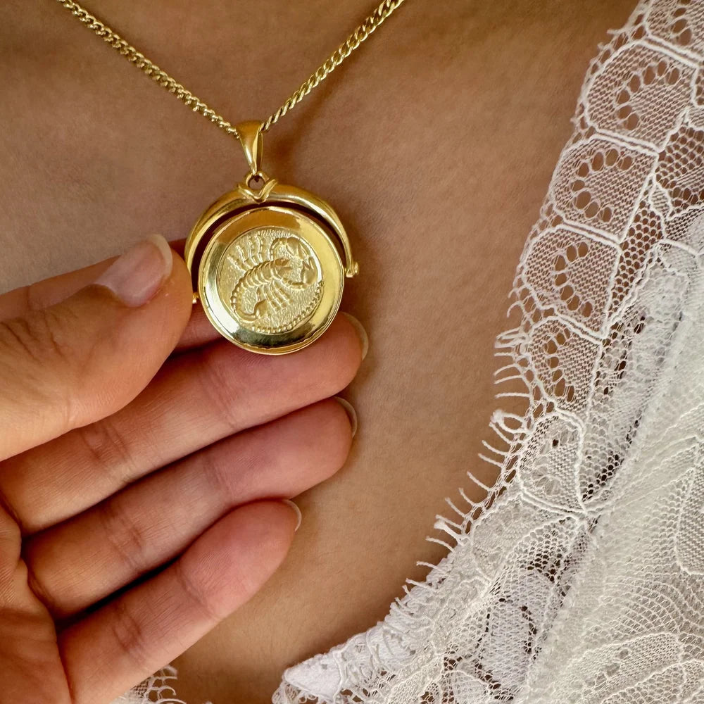 Gold pendant necklace featuring a unique embossed design, perfect for women seeking vintage-inspired elegance.