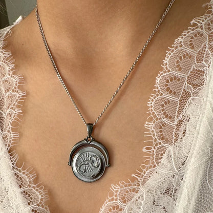 Silver vintage-inspired pendant necklace featuring a unique scorpion motif, perfect for women who love classic jewelry.