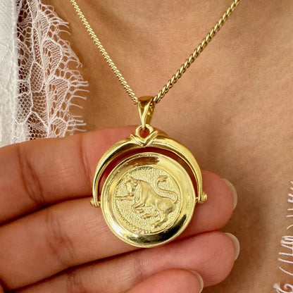 Gold zodiac pendant necklace featuring a lion design, perfect for stylish women seeking unique statement jewelry.