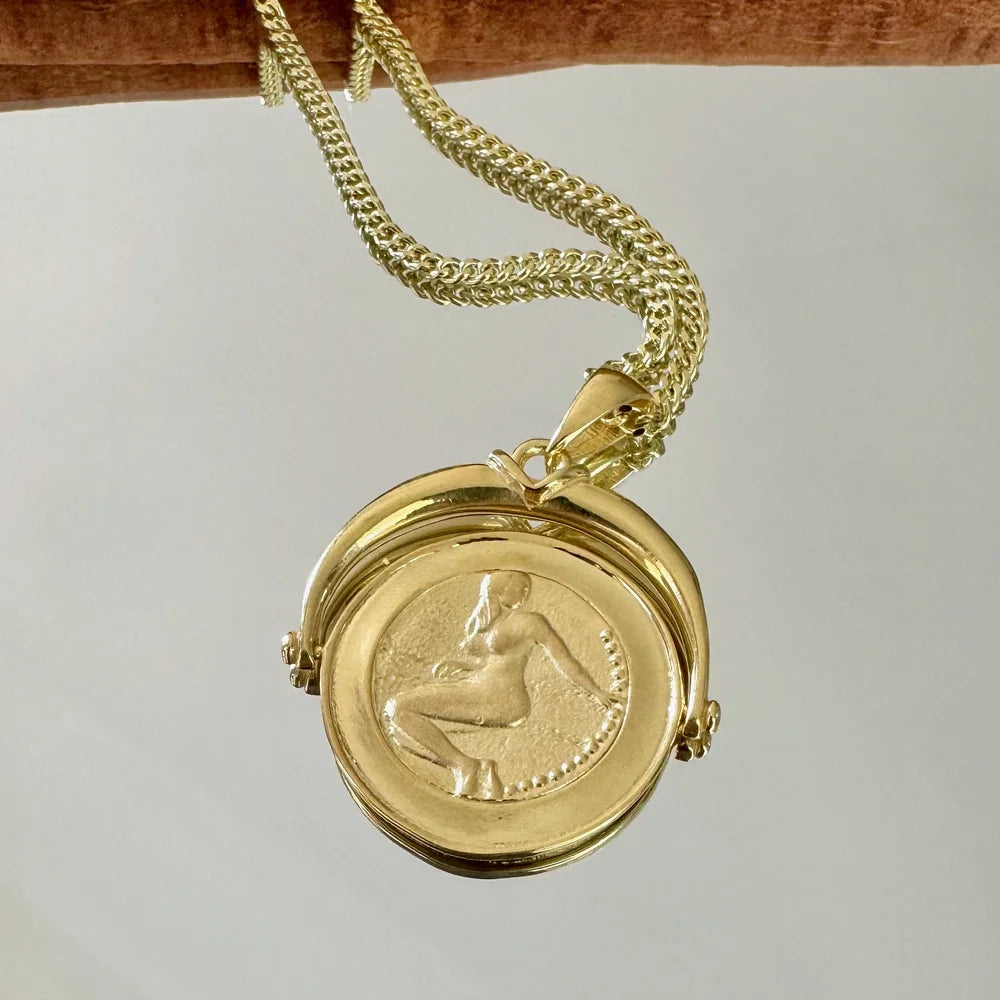 Gold vintage locket necklace with intricate design, perfect for women seeking timeless elegance for special occasions.