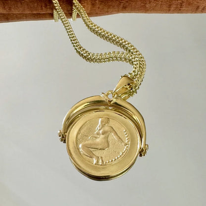 Gold vintage locket necklace with intricate design, perfect for women seeking timeless elegance for special occasions.