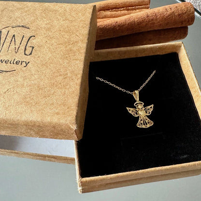 Delicate gold angel pendant necklace, perfect for women or men, ideal for gifting or special occasions. Elegant and unique design.