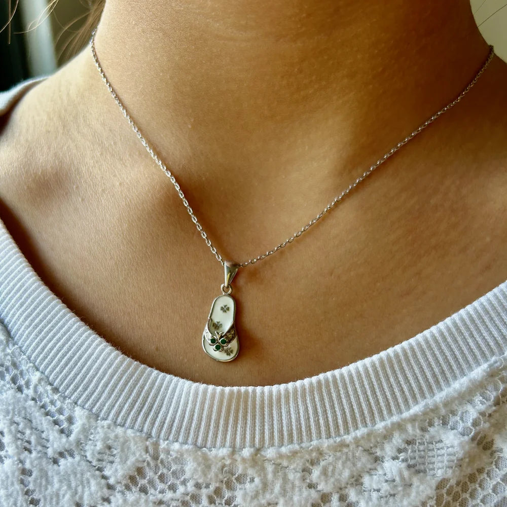 Delicate silver necklace featuring a floral pendant, perfect for women seeking a minimalist, elegant touch for casual occasions.