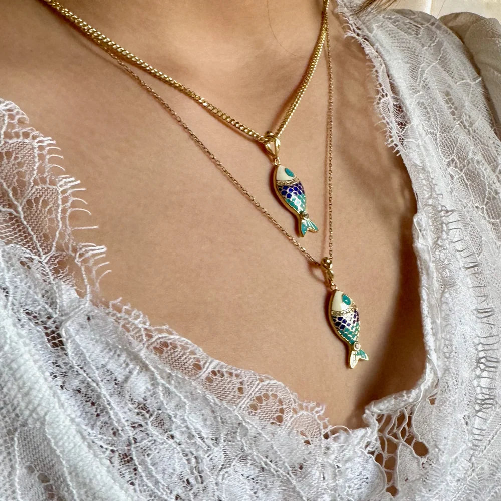 Gold fish pendant necklace with colorful enamel details, perfect for women seeking a stylish, bohemian accessory.