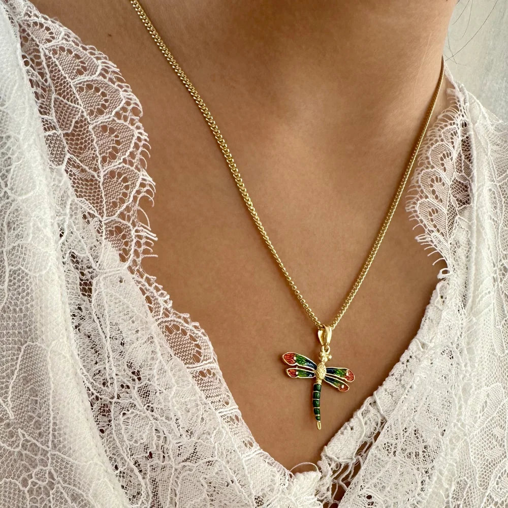 Gold dragonfly pendant necklace adorned with colorful gemstones, perfect for elegant women’s fashion. Ideal for special occasions.