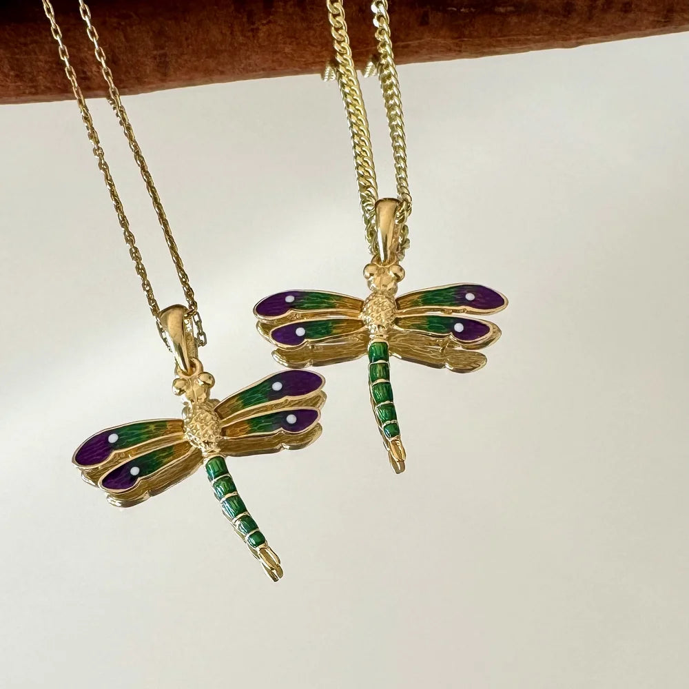 Gold dragonfly pendants with purple and green enamel, perfect for women seeking a vintage, whimsical style.