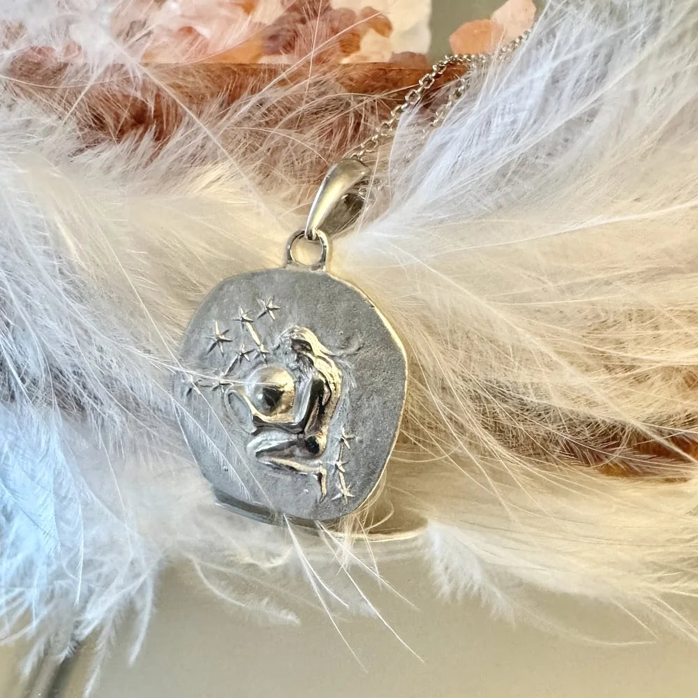 Sterling silver pendant featuring a celestial design, perfect for women who love unique, bohemian jewelry.