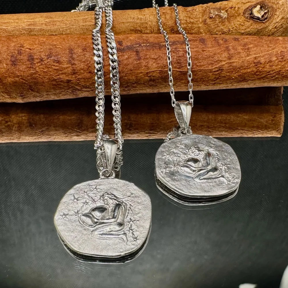 Silver couple pendants on delicate chains, perfect for women's romantic gifts or minimalist style. Ideal for special occasions.