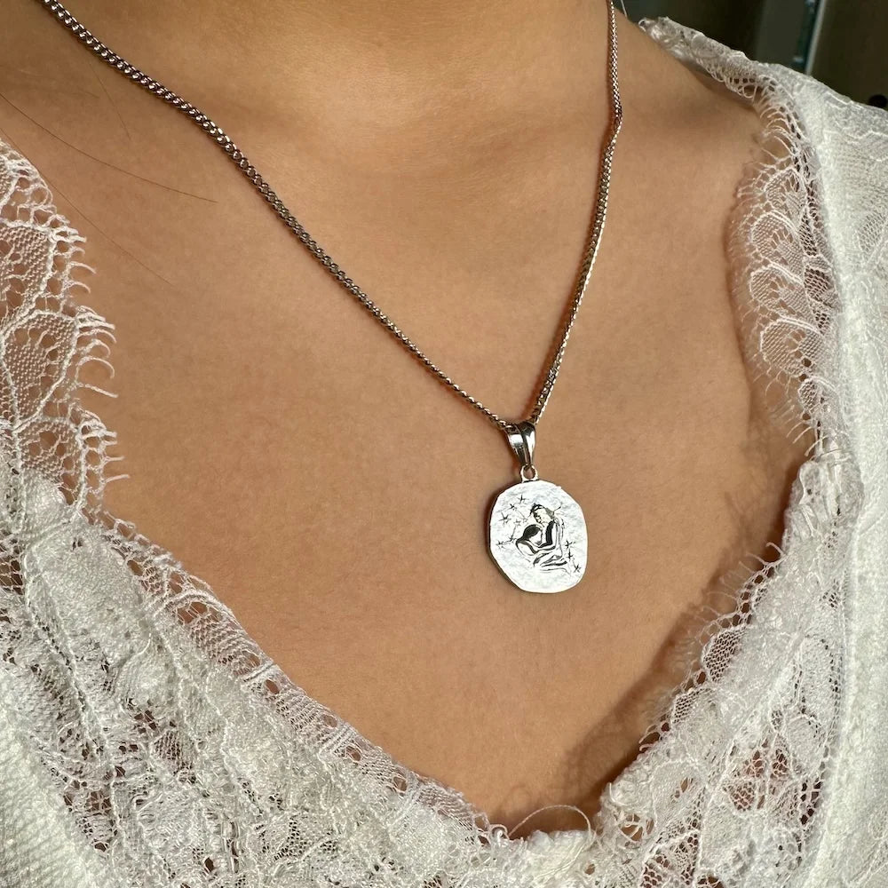 Sterling silver pendant necklace featuring a unique engraved design, perfect for women seeking a minimalist style.