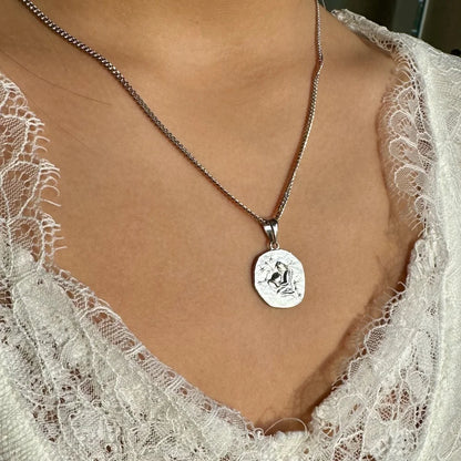 Sterling silver pendant necklace featuring a unique engraved design, perfect for women seeking a minimalist style.