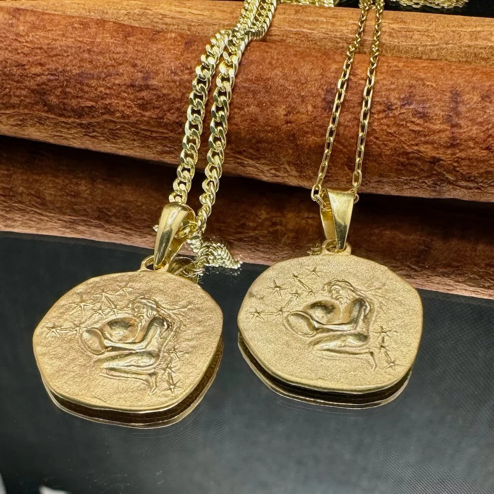 Gold Aquarius pendant necklace for women, featuring intricate zodiac design, perfect for astrology lovers and special occasions.