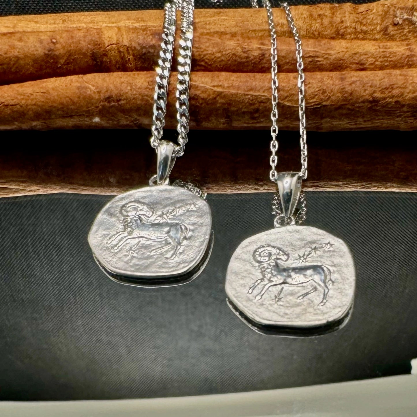 Sterling silver zodiac pendant necklaces featuring intricate ram designs, perfect for astrology lovers and unisex style.