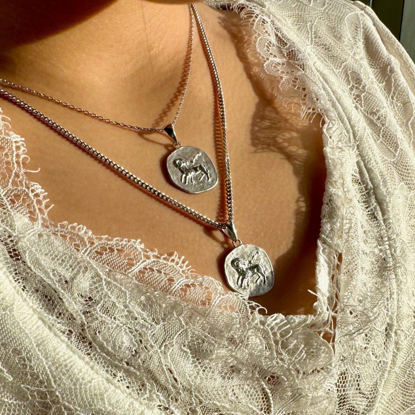 Silver pendant necklace set featuring unique designs, perfect for women seeking minimalist, bohemian style.