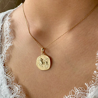 Gold zodiac pendant necklace featuring a ram design, perfect for women who love minimalist astrology jewelry.