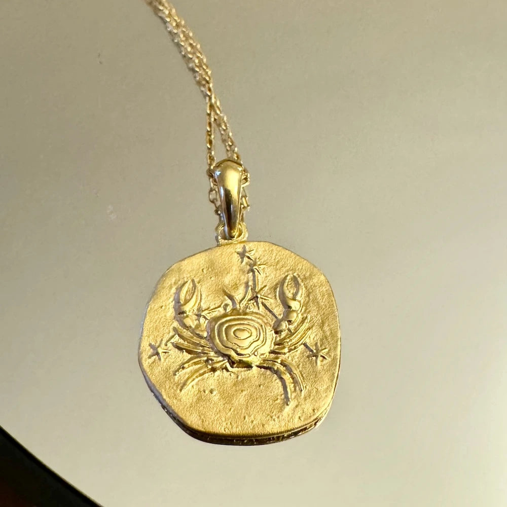 Gold crab pendant necklace, perfect for women who love unique, bohemian styles; great for casual or special occasions.