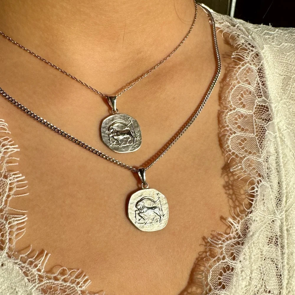 Stylish silver zodiac charm necklaces, perfect for women who love unique, bohemian jewelry for everyday wear.