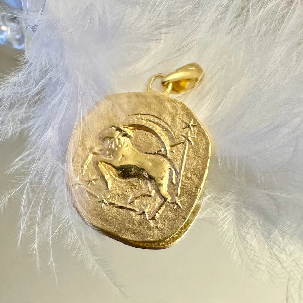 Gold Capricorn zodiac pendant charm, perfect for women who love vintage styles and astrology jewelry. Ideal for everyday wear.