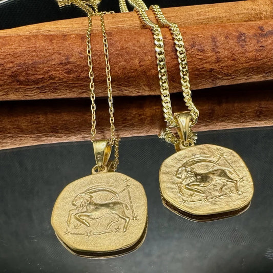 Gold zodiac sign pendant necklace for women, featuring an ornate Capricorn design, perfect for casual or special occasions.