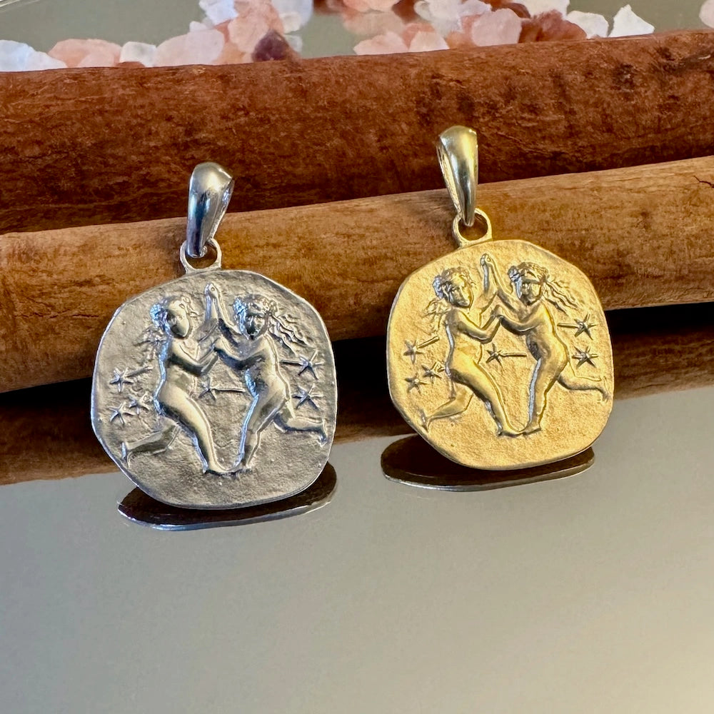 Vintage gold and silver Gemini zodiac pendants, perfect for women seeking unique astrological jewelry.