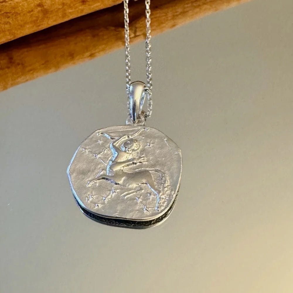 Sterling silver zodiac pendant necklace featuring a centaur design, perfect for women who love unique, celestial jewelry.
