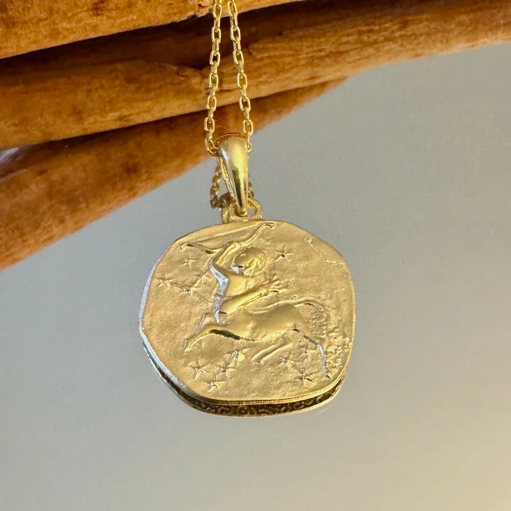 Gold zodiac pendant necklace featuring a Capricorn design, perfect for women who appreciate bohemian elegance.