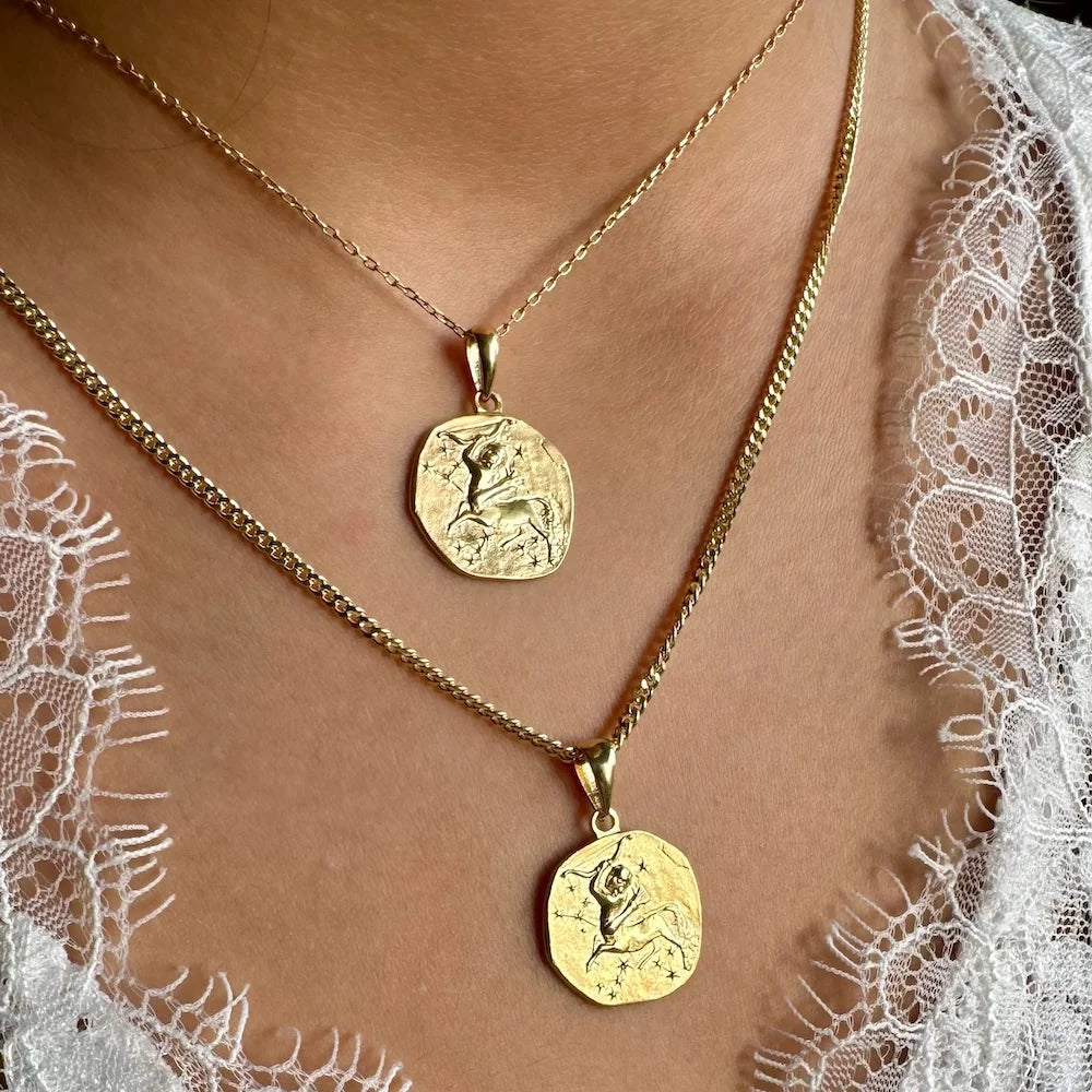 Gold pendant necklace set with intricate designs, perfect for women seeking a classic yet trendy bohemian look.