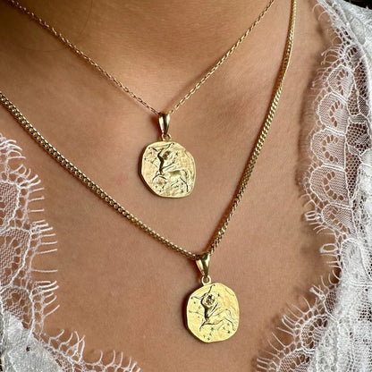 Gold pendant necklace set with intricate designs, perfect for women seeking a classic yet trendy bohemian look.