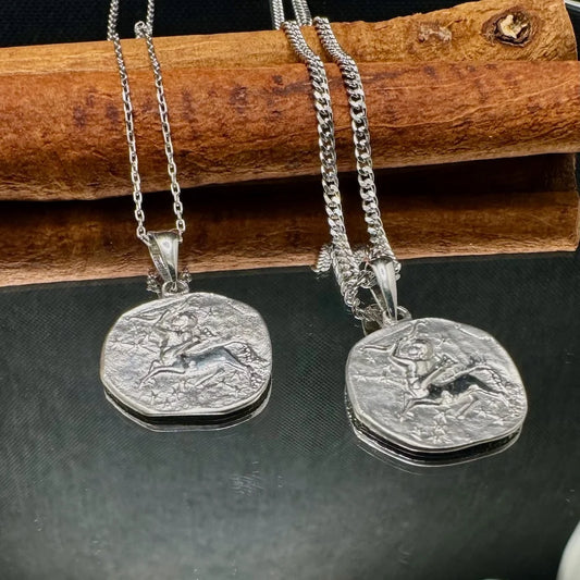 Silver vintage-style necklaces featuring unique engraved pendants, perfect for men or women seeking classic charm.