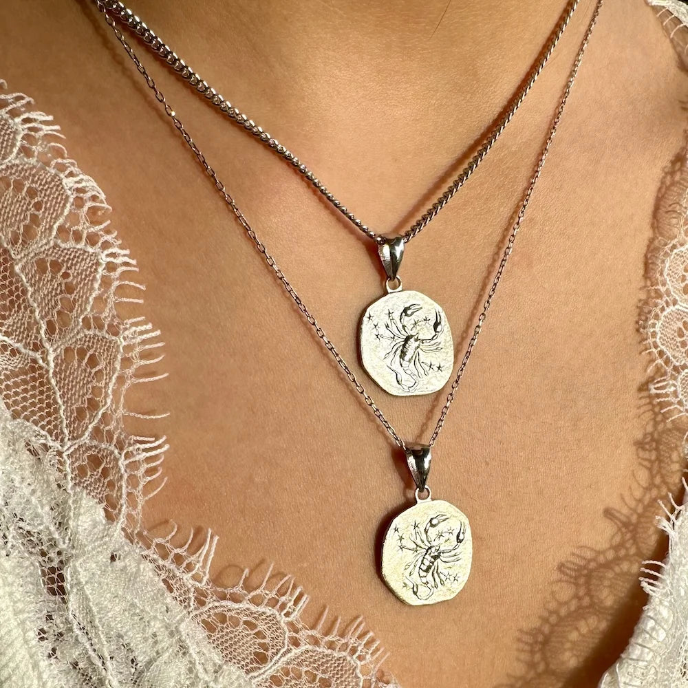 Silver zodiac constellation pendant necklace, perfect for women seeking a celestial vintage style. Ideal for everyday wear.