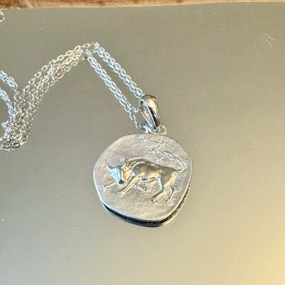 Silver bull pendant necklace for men, featuring intricate detailing, perfect for casual or bohemian styles.